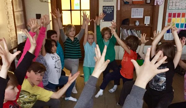 Kids Doing Yoga in Classroom