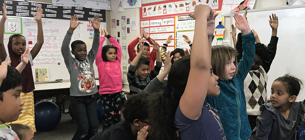 Elementary Students Doing Yoga in Classroom